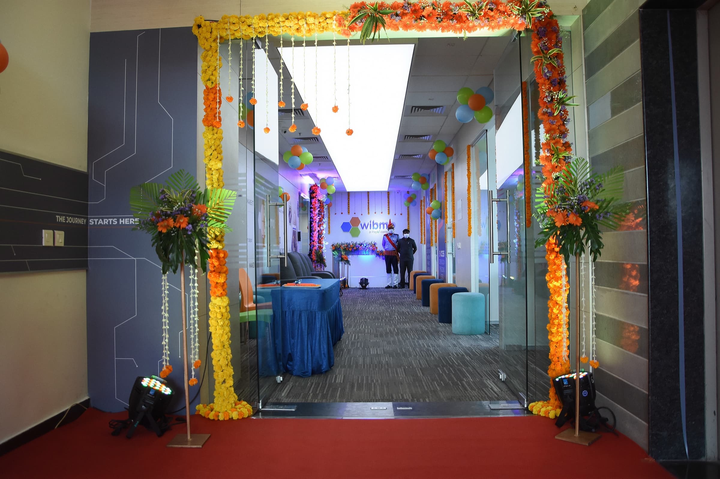 A marigold corridor leading into a BrandM event hall